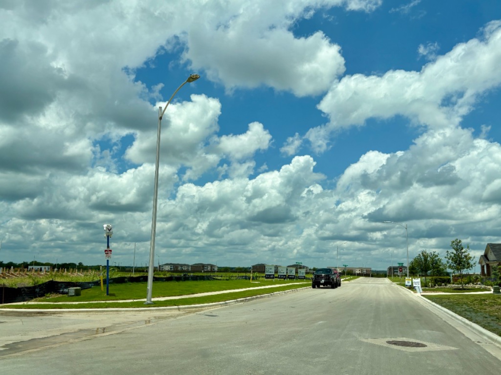 Near the Whisper South model home with Whispering Pointe in the background