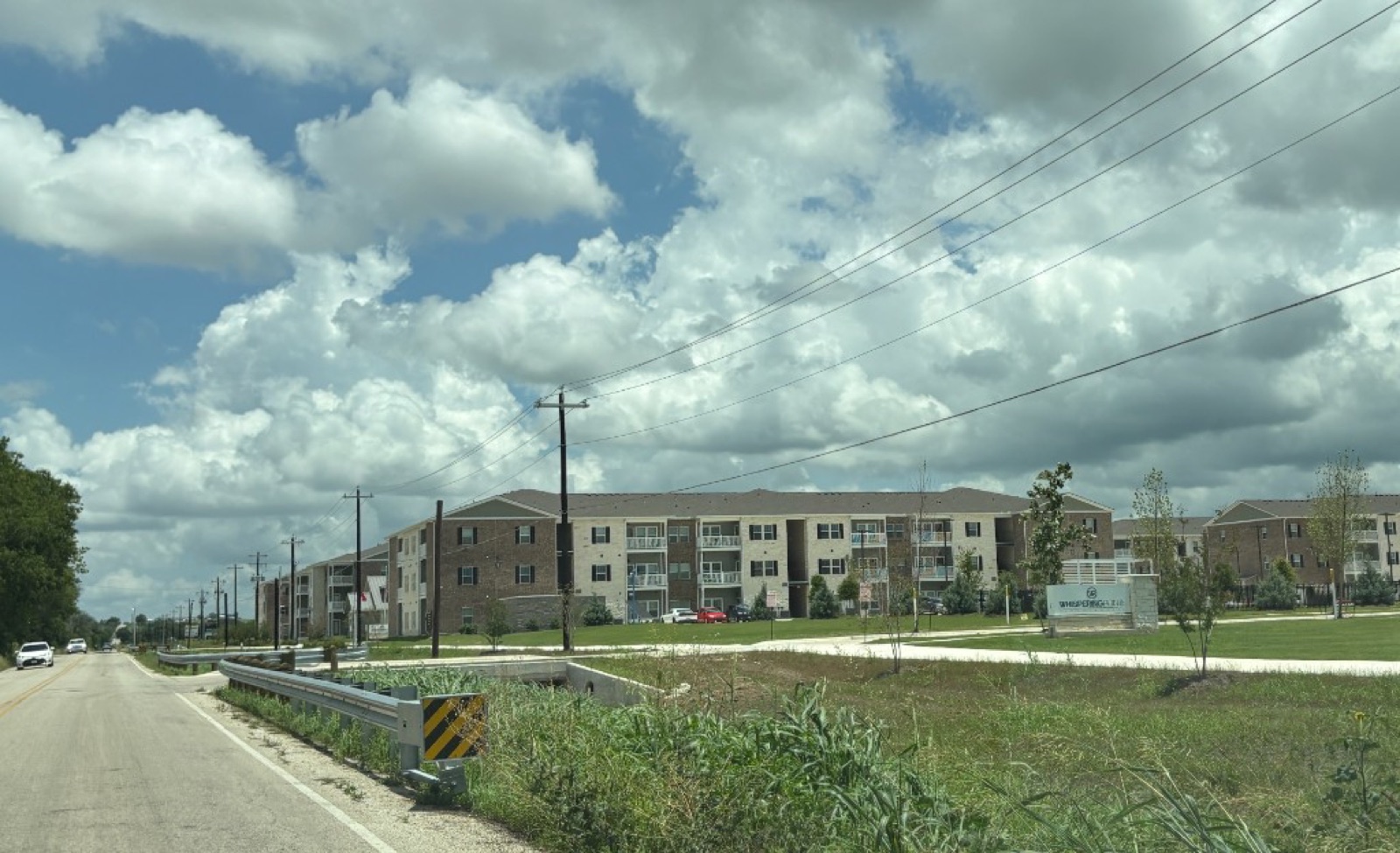 Entrance to Whispering Pointe Apartments, 0.2 miles from the property